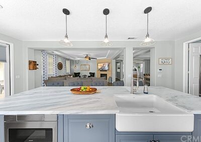 A kitchen with a marble counter top.